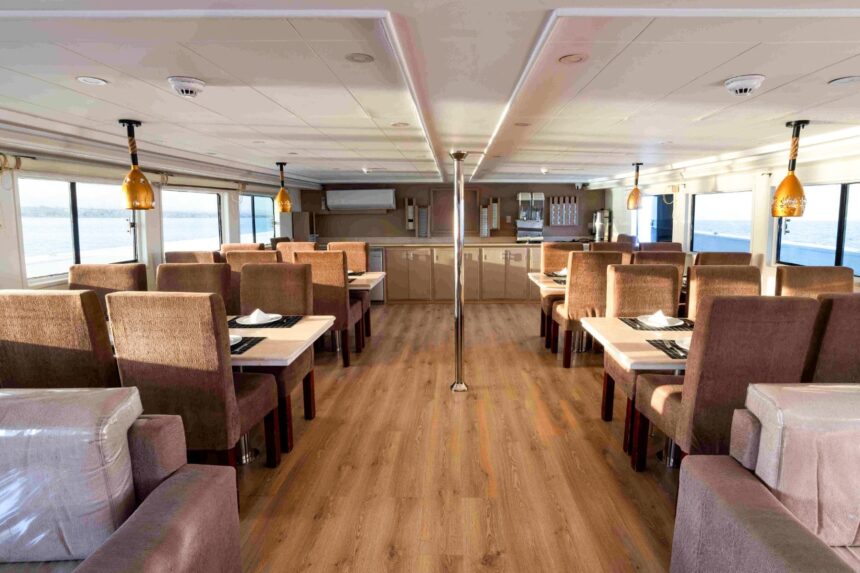 Liveaboard dining room with wooden tables and hanging lanterns