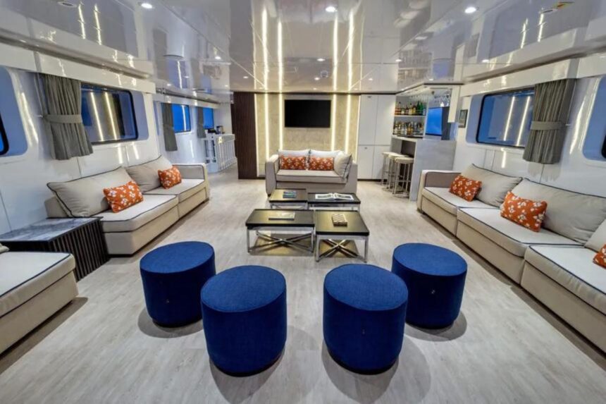 Spacious salon with sofas, TV, and bar aboard Galaxy Diver II
