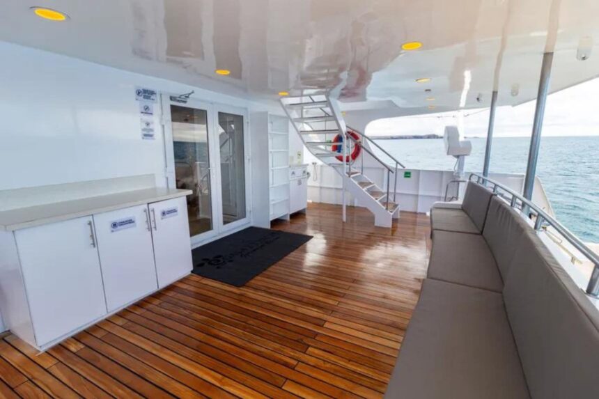 Outdoor deck with stairs and lounge seating aboard Galaxy Diver II