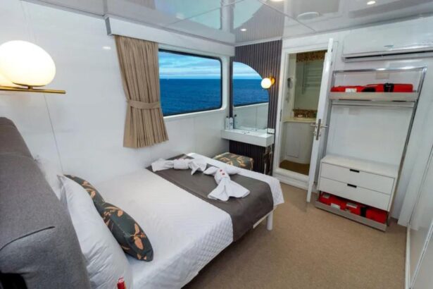 Cabin bathroom with vanity mirror and sink aboard Galaxy Diver II