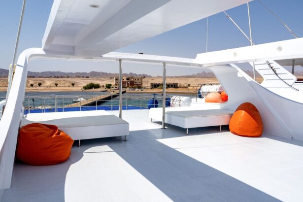 Shaded sun deck with orange bean bags and loungers aboard the Titan liveaboard