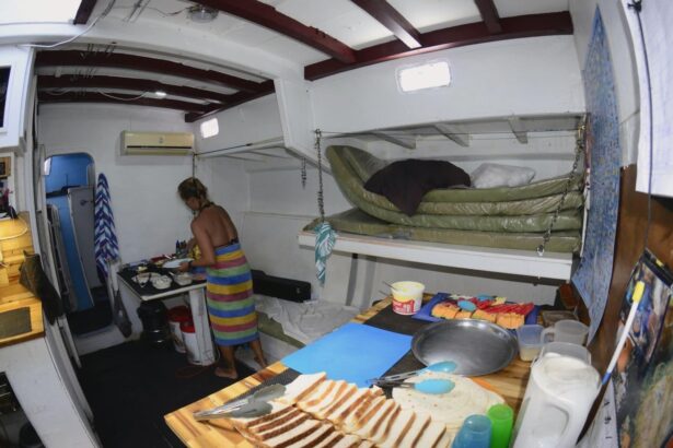 Crew member preparing sandwiches and snacks in the galley of the SV Rum Runner