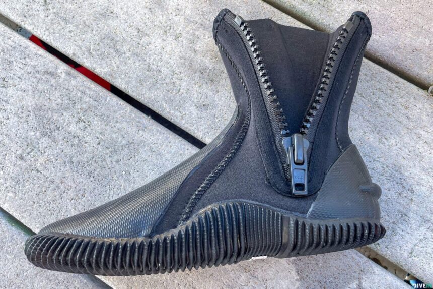 Cressi Minorca 3 mm dive boot seen from above with the side zip open, showing the ribbed sole and reinforced toe