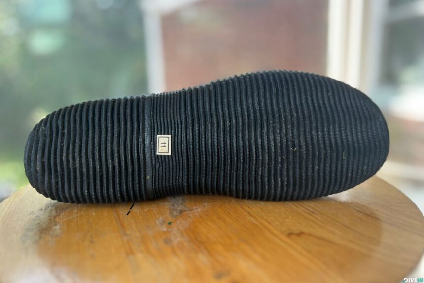 Underside of a Cressi Minorca 3 mm dive boot showing the full ribbed rubber sole and size 11 stamp