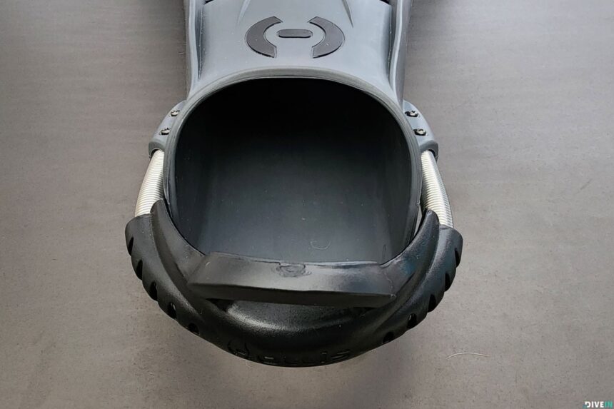 Head-on view into the wide foot pocket of the Hollis F1 LT fin with the spring strap attached on both sides