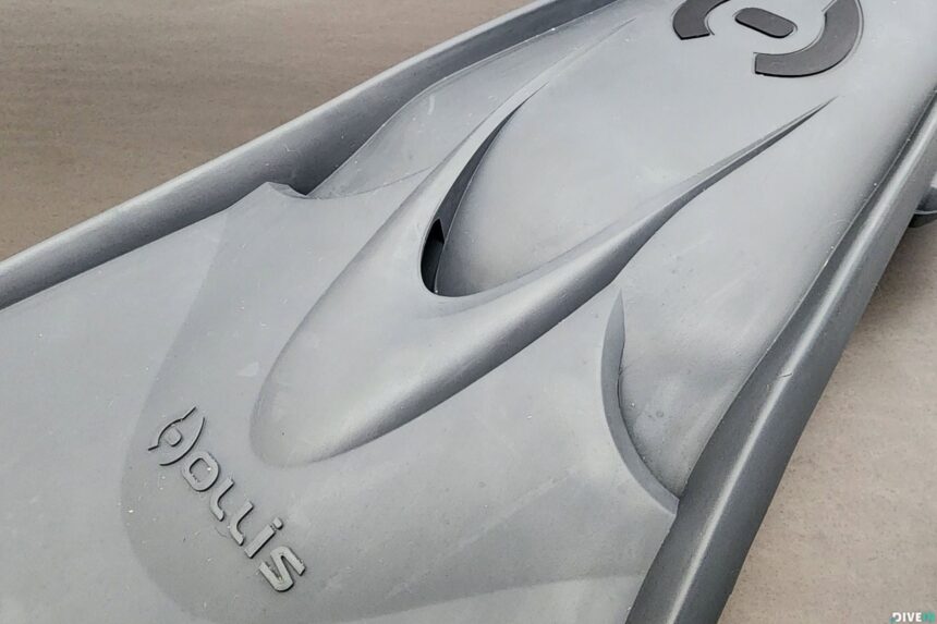 Grey Hollis F1 LT fin blade seen from the tip end, showing the raised channel ribs and side rails