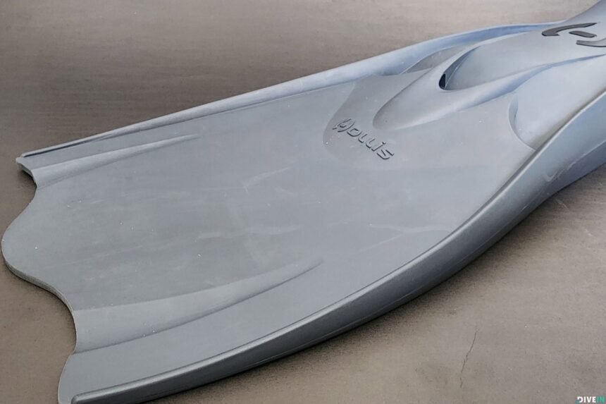 Outside edge and blade rail of the grey Hollis F1 LT fin resting on a concrete floor