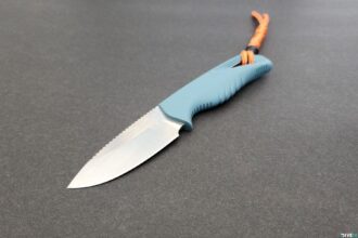 Benchmade Intersect dive knife with light blue handle, orange lanyard and part-serrated blade