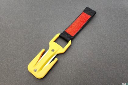 EEZYCUT Trilobite line cutter with yellow body and black hook-and-loop strap with red patch