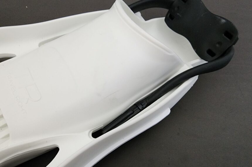 Black heel pad and bungee strap fitted to the back of a TUSA Travel Right fin