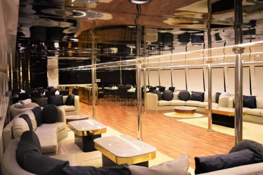 Sundeck seating aboard the Hammerhead II with cream sofas and beanbags overlooking the harbor
