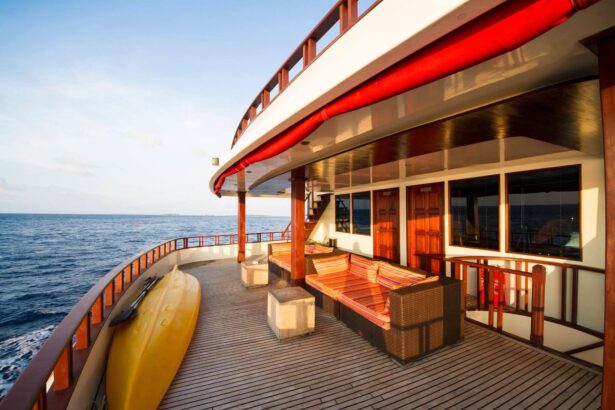 Sundeck aboard MV Theia with a yellow kayak stowed at the rail