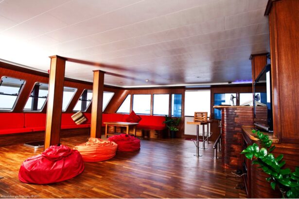 Red and orange beanbags and sofa seating in MV Theia's saloon