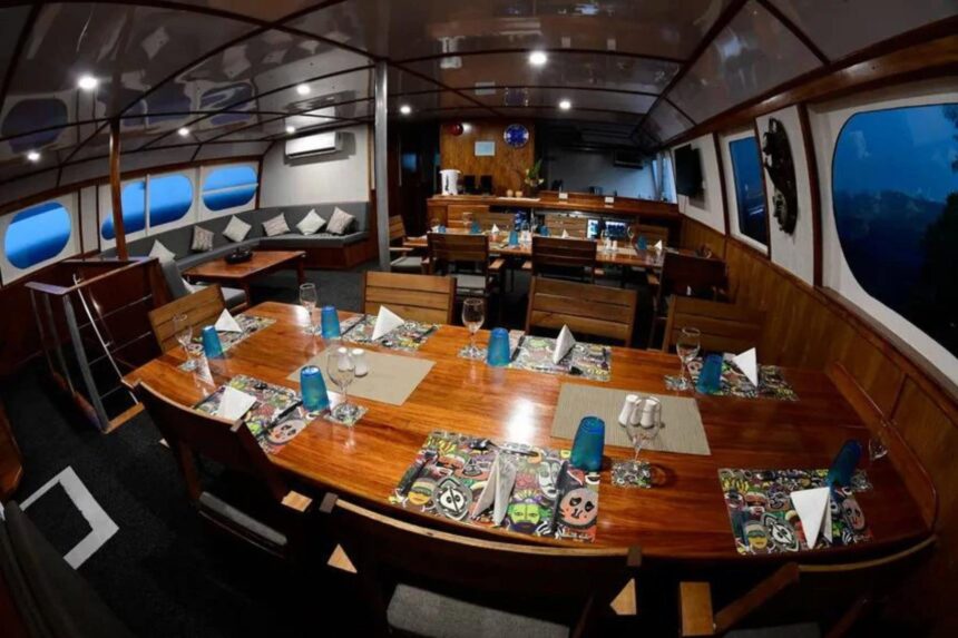 Dining table set for an evening meal aboard MV Oceania