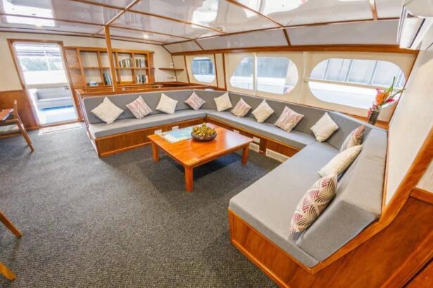 Sectional lounge seating with patterned cushions inside MV Oceania