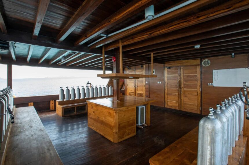 Scuba cylinders staged for filling aboard Indo Master's dive deck