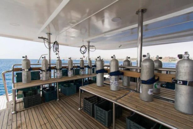 Aluminum scuba tanks racked along the dive deck of the Sea Serpent Contessa