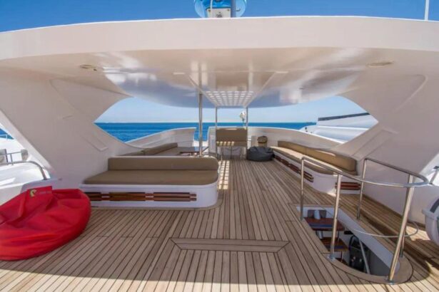 Stern sun deck with red beanbags and a staircase on the Sea Serpent Contessa