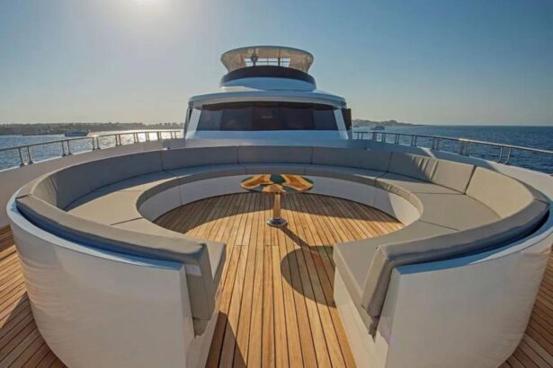 Upper deck lounge with a staircase and colorful chairs aboard the Sea Serpent Excellence