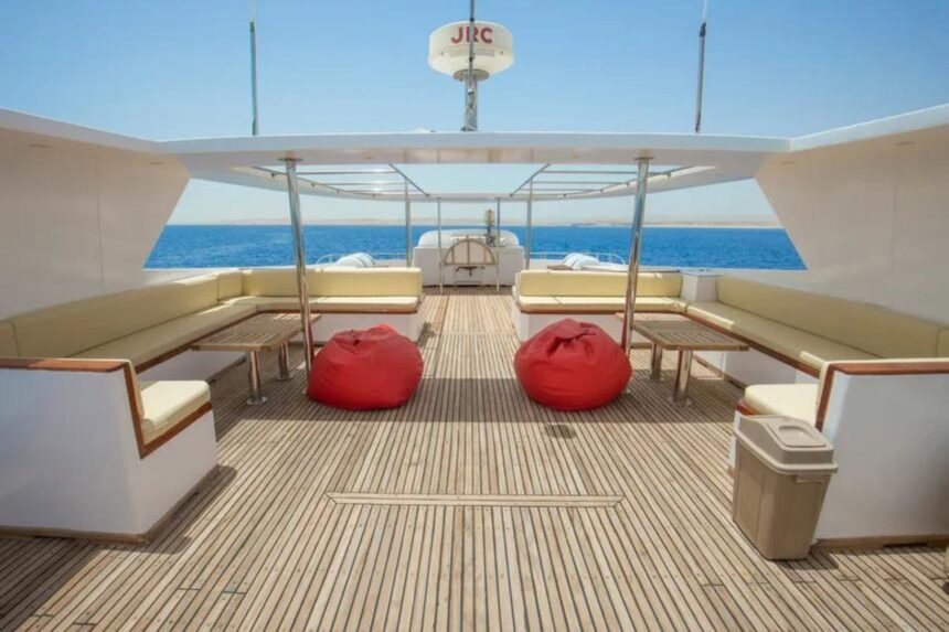 sun deck with red bean bag seating aboard the Sea Serpent