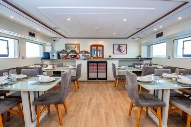dining salon set with tables aboard the Sea Serpent