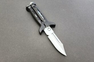 XS Scuba FogCutter X dive knife with black handle and stainless blade with a serrated section