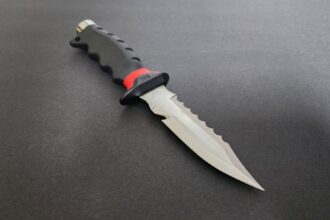 Promate Barracuda sharp tip titanium dive knife with serrated edge and black and red moulded handle