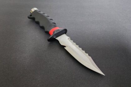 Promate Barracuda sharp tip titanium dive knife with serrated edge and black and red moulded handle