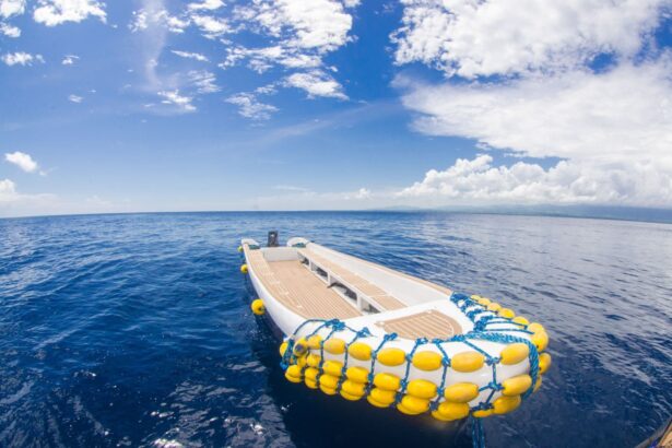 tender boat with yellow fenders floating on calm water