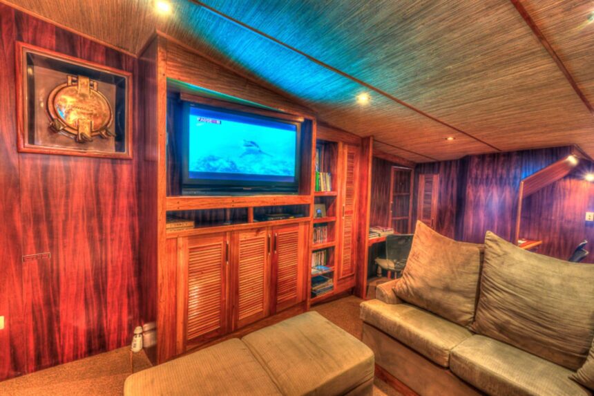 wood-paneled lounge with television aboard the MV Ocean Hunter III