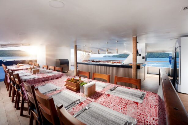 Covered dining tables set for guests aboard the Solitude One
