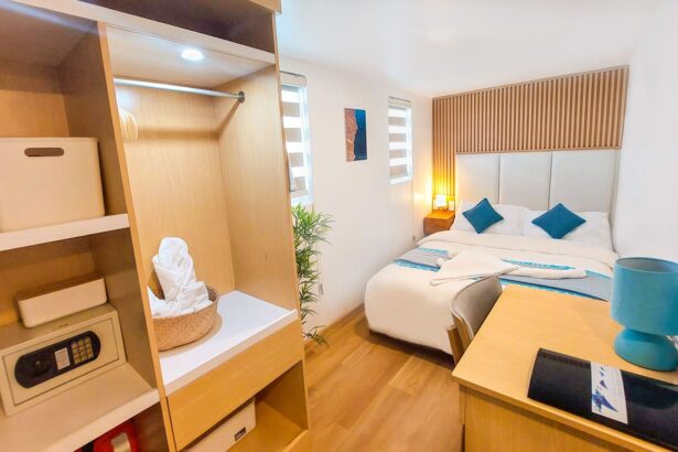 Cabin storage with wardrobe, safe and folded towels aboard the Solitude One