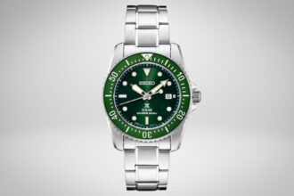Seiko SNE583 Prospex solar diver with green dial and matching green bezel on a steel bracelet