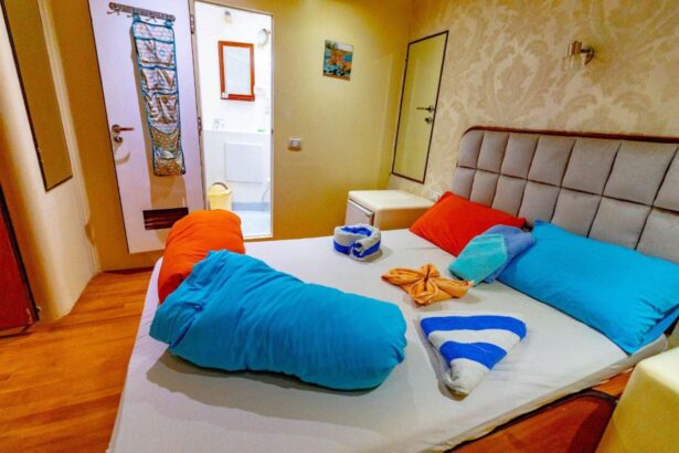 Cabin bed on the Betelgueser dressed with colorful towels and pillows