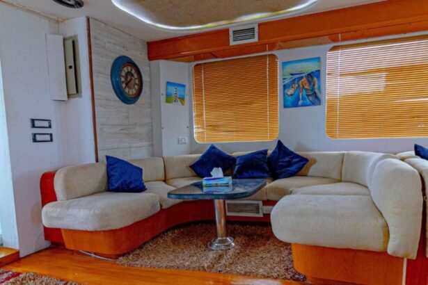 Indoor lounge with blue and gold cushioned sofas on the Betelgueser