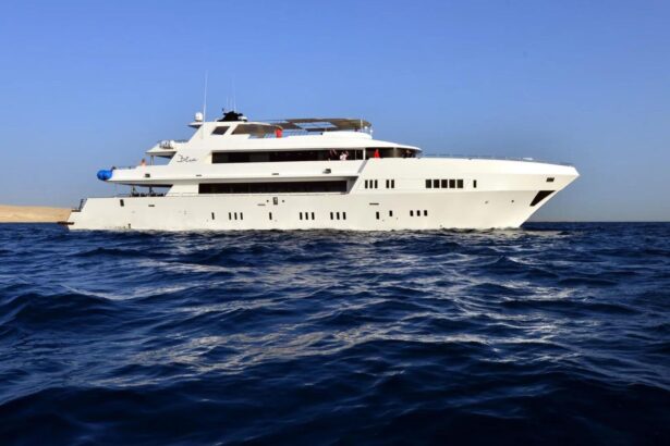 the liveaboard MY Blue cruising along a desert coastline