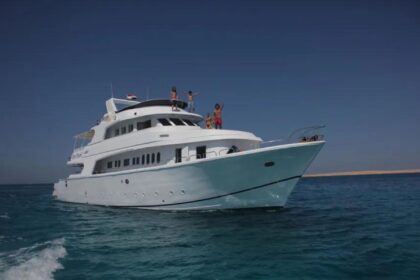 guests waving from the top deck of the MY Blue Planet 1 liveaboard