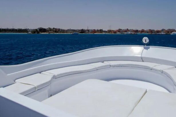 Curved white sun lounge seating on the MY Blue Planet 1 upper deck