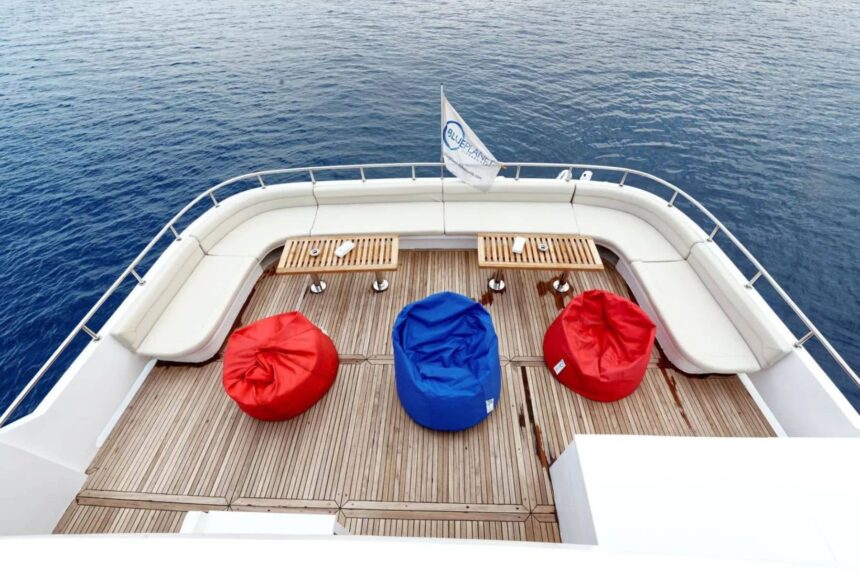 Shaded deck lounge with red and blue bean bags on the MY Blue Pearl