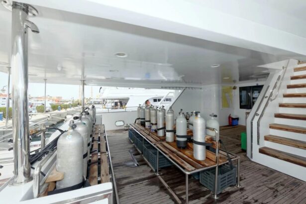 Scuba tanks racked on deck ready for diving on the MY Blue Pearl