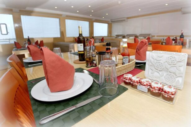 Dining table set with wine and condiments aboard the MY Blue Pearl