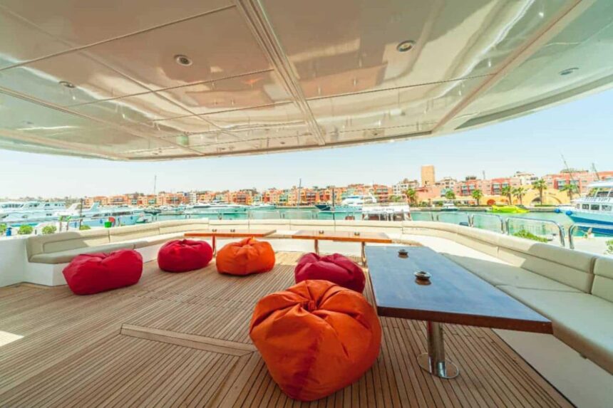 Deck lounge with red bean bags overlooking the marina on the MY Blue Storm