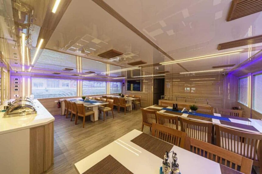 Restaurant seating area with dining tables aboard the MY Blue Storm