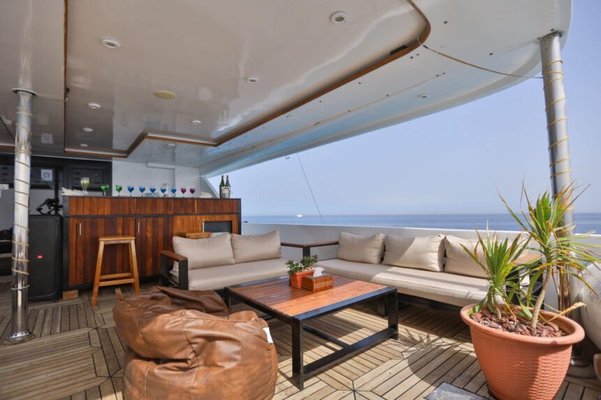 Covered outdoor bar and lounge seating on the Captain Sparrow's top deck