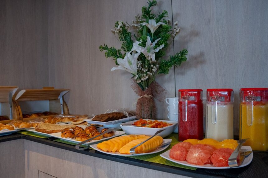 Breakfast buffet spread of pastries, melon, and fruit juices on the Captain Sparrow