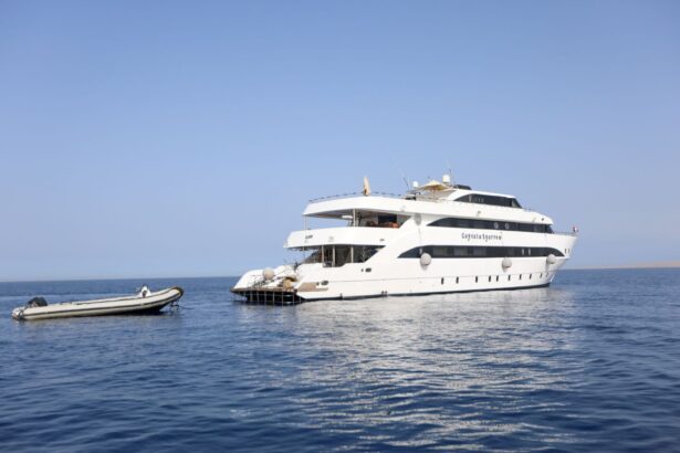 Captain Sparrow liveaboard anchored at sea with its tender boat alongside