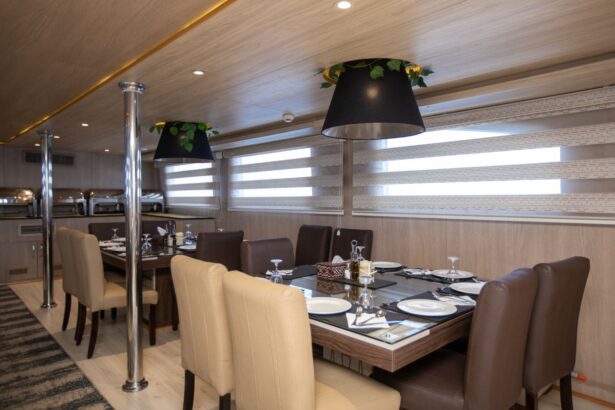 Formal dining room with leather chairs and pendant lamps aboard the Captain Sparrow