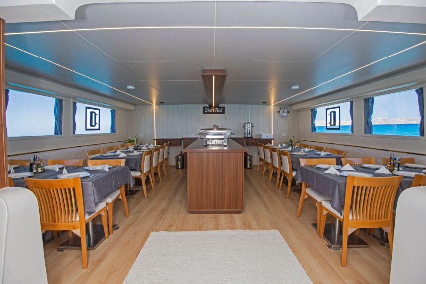 Dining room on the Dolce Vita set with tables, chairs and a central buffet station