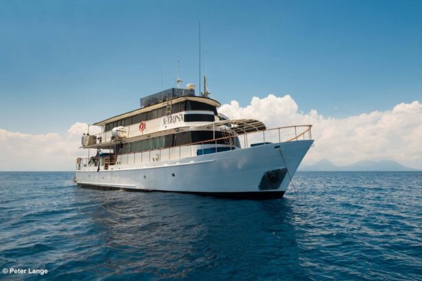MV FeBrina liveaboard dive boat anchored at sea under blue sky
