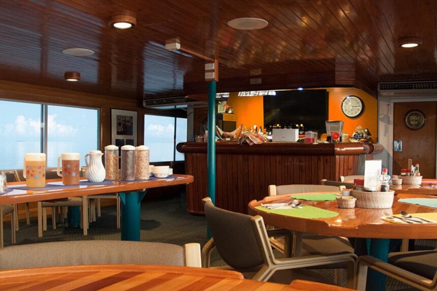 Bar and dining tables set for breakfast aboard the Odyssey liveaboard